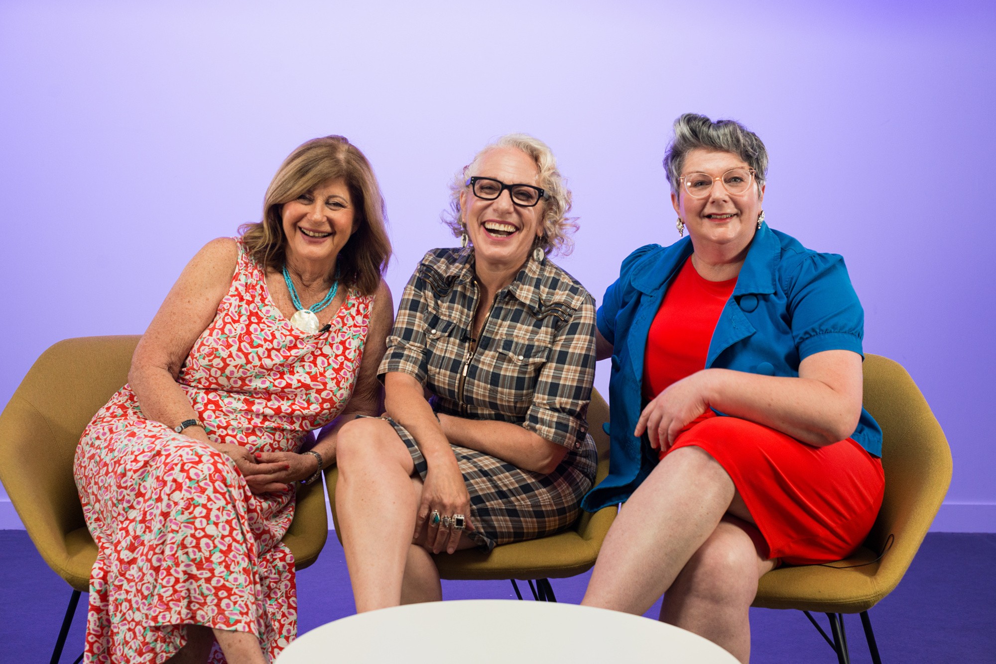 Lovehoney's Queen Bees, Judith, Suzanne, and Tina, sitting and laughing